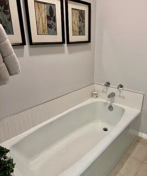 Bathtub in primary bath.