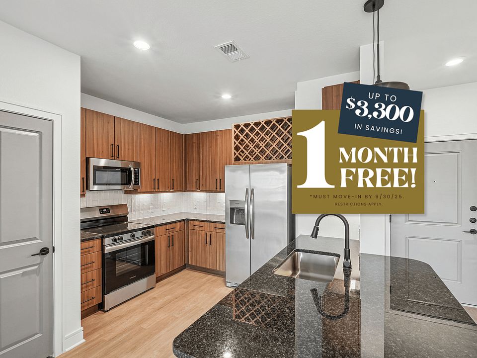 Kitchen with Granite Countertop and Stainless Steel Appliances.
