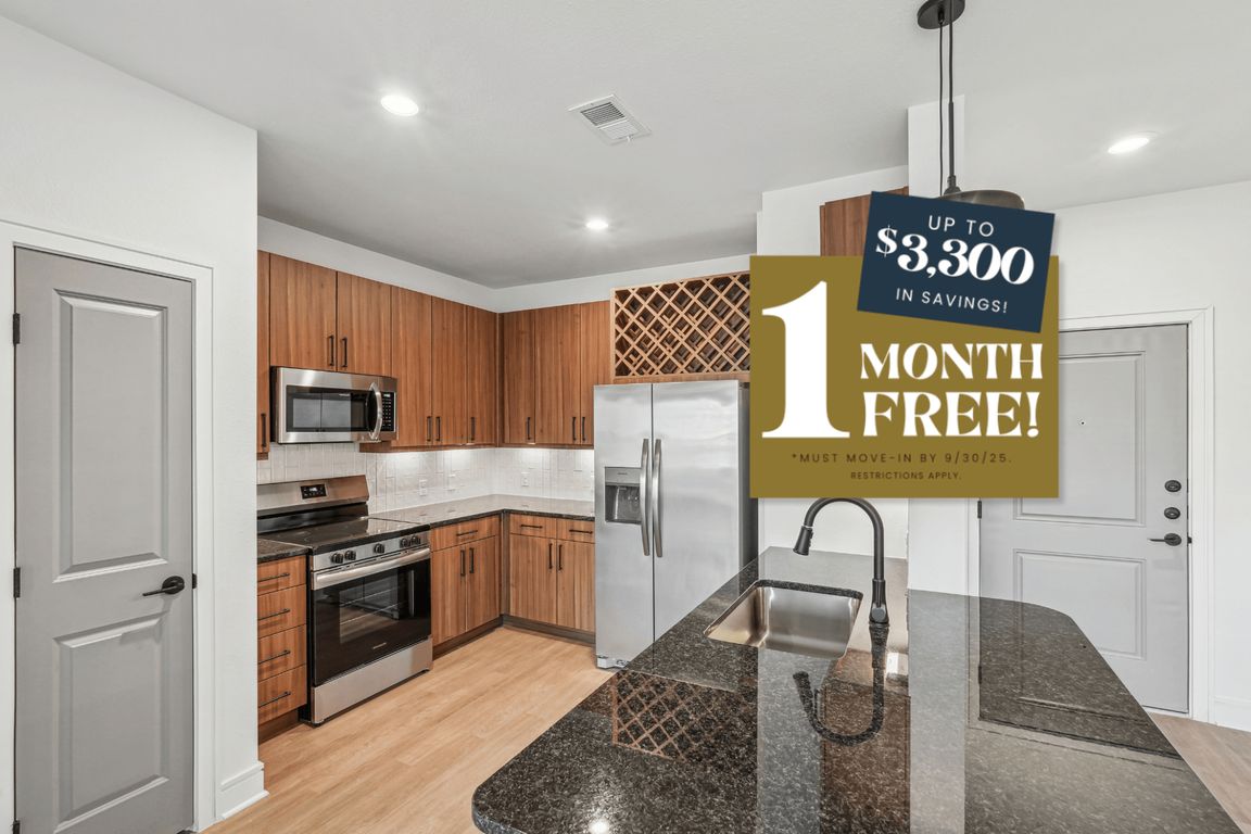 Kitchen with Granite Countertop and Stainless Steel Appliances.