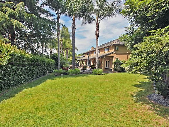 Ideally located on an enviable pie-shaped lot that fans out to give outdoor space where you enjoy it most! Sized at over 1/3 acr