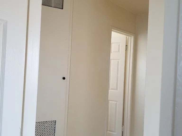 Small walkway leading to the bathroom. Picture was taken from bedroom #2