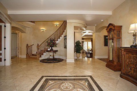 Stately entry with curved staircase