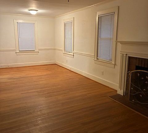 Living room / Dining area. Fireplace is there and looks nice, but we request it is not used for wood burning.