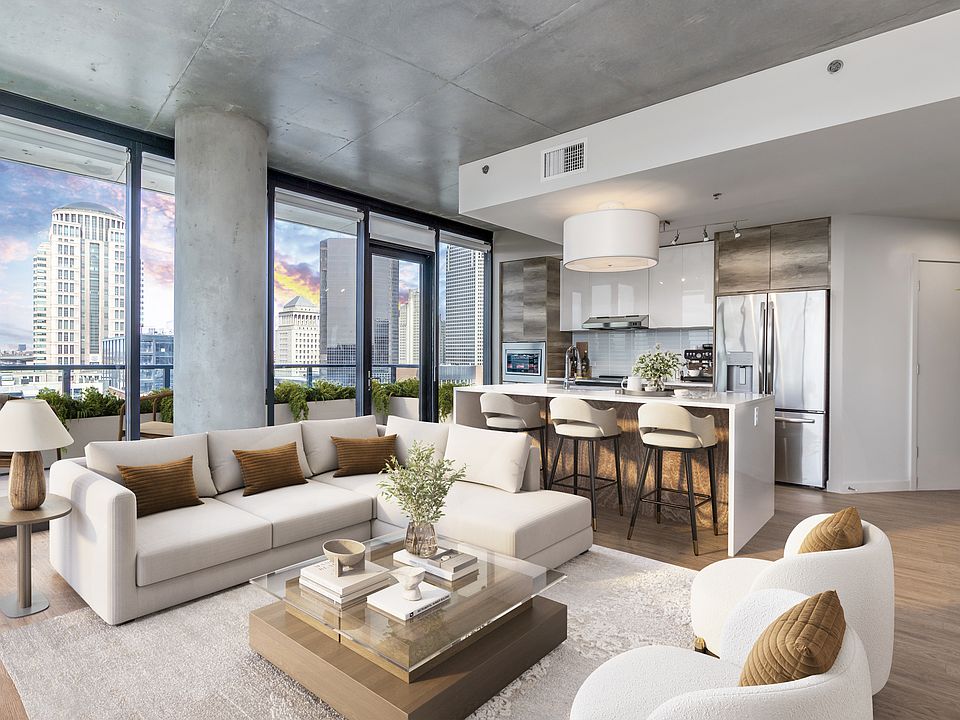 Open-concept living with floor to ceiling windows at One Cardinal Way
