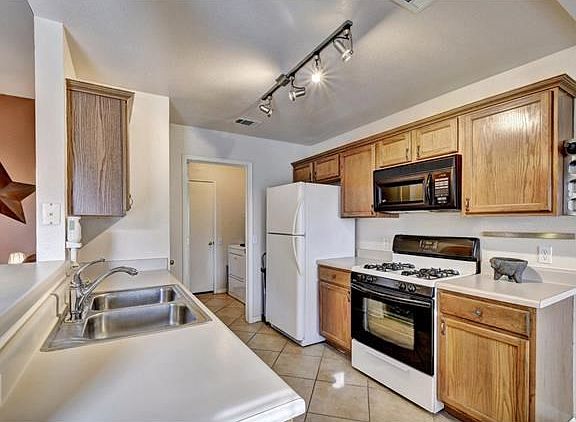 Kitchen is open to the family room so the cook can be a part of the action.  Breakfast bar is great for quick meals or serving food at parties
