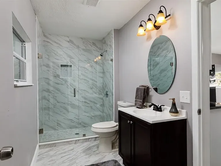 Updated Bathroom with sleek glass walk-in shower