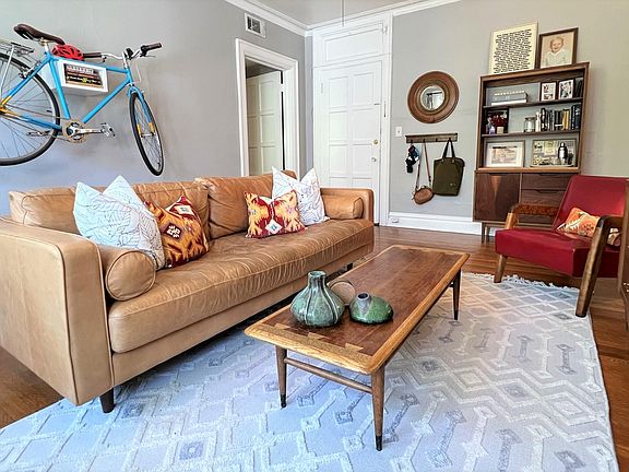 Living room, apartment front door, and doorway to hall