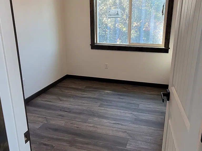 Main floor bedroom appears smaller in picture