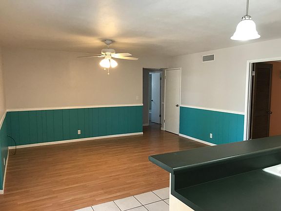 Family room. Picture taken from kitchen. Hallway leads to 3 bedrooms and 2 bathrooms.