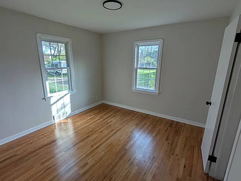 Bedroom 2 located on the first floor has hard woods, 2 windows and a standard closet.