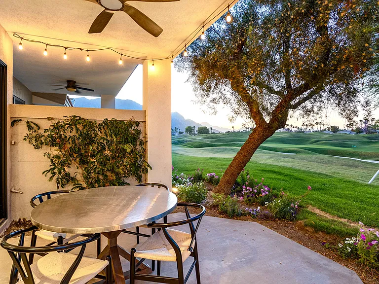 The covered patio features a fan sure to keep you cool and seats four.