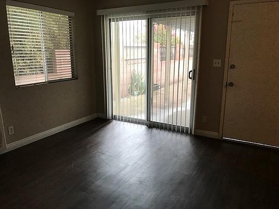 Living room looking out to patio with lots of light