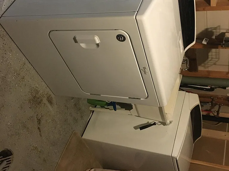 full size washer and dryer in a laundry room
