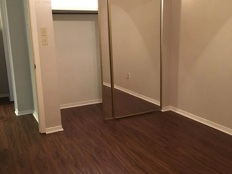 Bedroom with mirrored closet doors