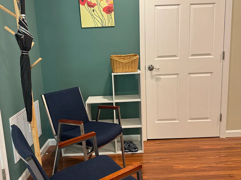 Entrance has seating area with storage for shoes & bags & jackets/coats. The door to the laundry room & storage.