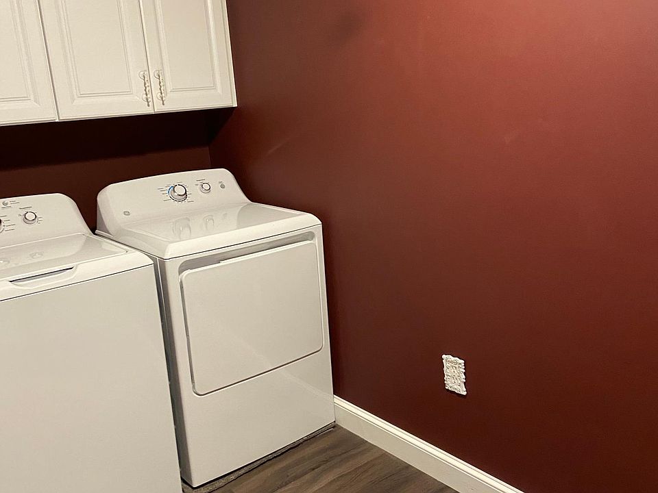 Large laundry room with attic storage.