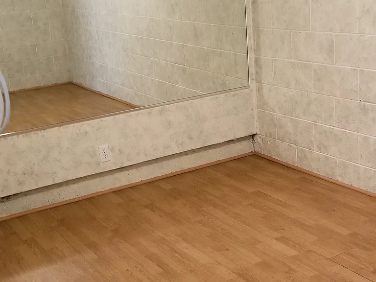Bonus room off of garage. Dimensions are 9 feet x 14 feet (approximately 125 Square Feet)