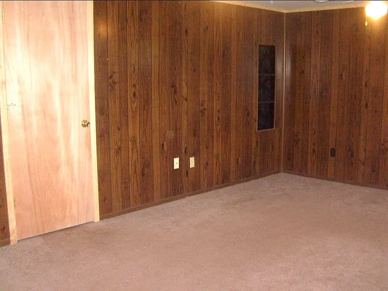 Family room/utility room leading to living room.