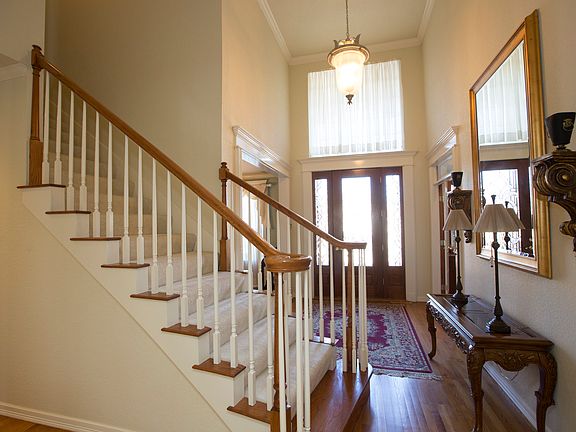 Entryway has 9+ High Ceiling Stairs Leading to 2nd Floor