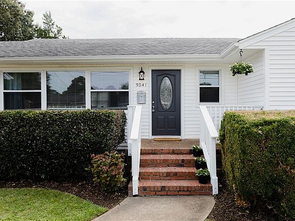 Newly painted front door, garage door and new exterior lights in front and backyard