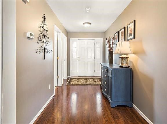 Inviting entry foyer opens to vaulted great room.