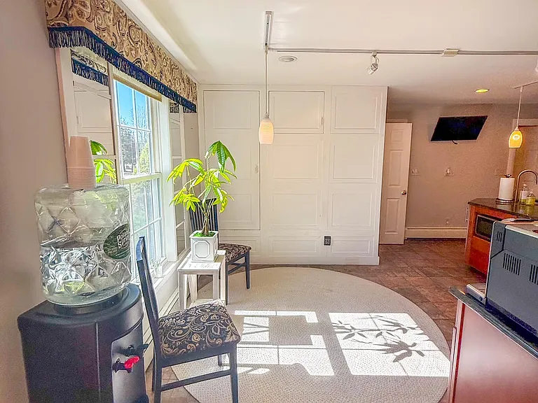 kitchen nook with walk in pantry