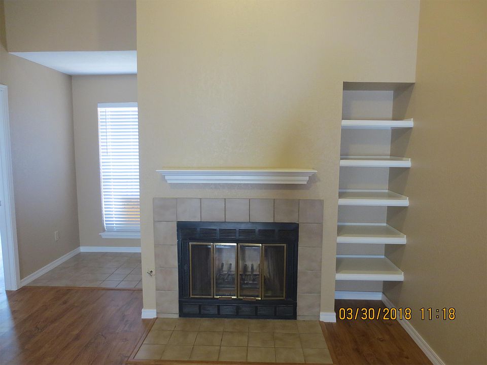 Fireplace with built in shelves