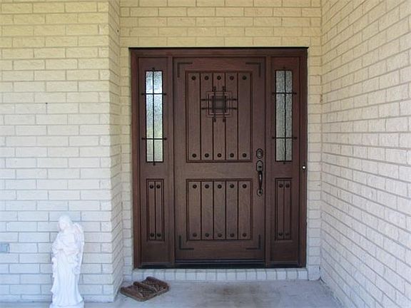 Custom built front door with trap door.
