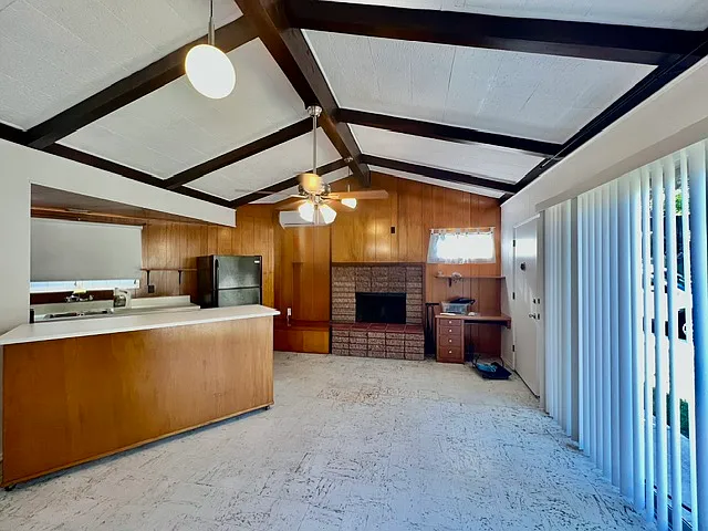 Living area, dining bar, front window(currently has light filtering drapes)