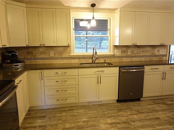 Custom Kitchen, with abundant cabinetry and countertop space, recessed lighting.