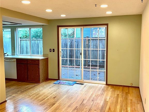 Slider off dining area out to backyard.