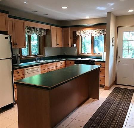 Very functional kitchen and where the front entrance is located.