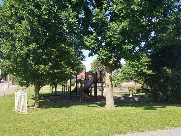 This adorable park backs up to the alley behind house. Instead of neighbors in your back you have this lovely green space. Neighborhood/community garden is to the right of this park.