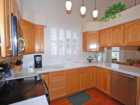 Modern kitchen is in center of the home