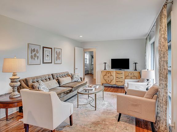 Upon entering the home, you are greeted by the living room and breakfast nook.
