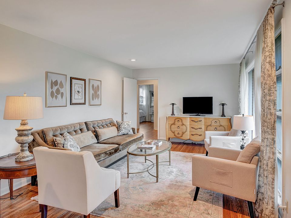 Upon entering the home, you are greeted by the living room and breakfast nook.