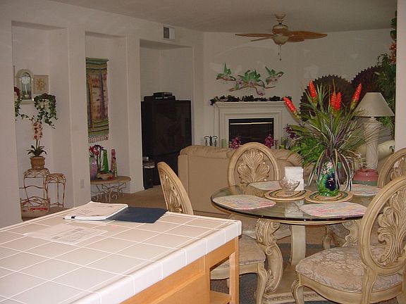 Familyroom w/ fireplace, entertainment niche visable from the kitchen.