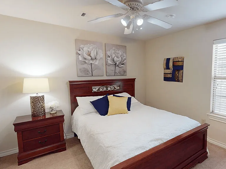 Bedroom with Ceiling Fan and Overhead Light