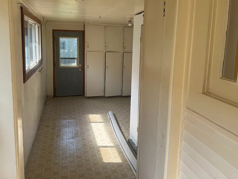 Utility room with hook ups for washer and dryer also has lots of storage space so your garage can be used for projects or vehicle storage.