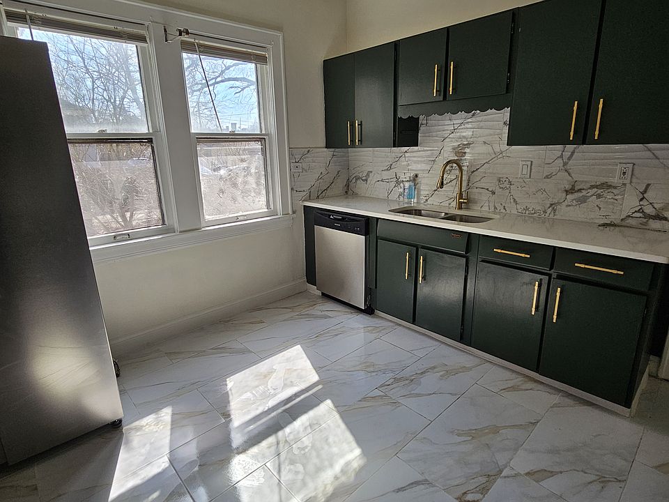 Beautifully remodeled kitchen with marble tile floors, quartz countertop and brand new appliances