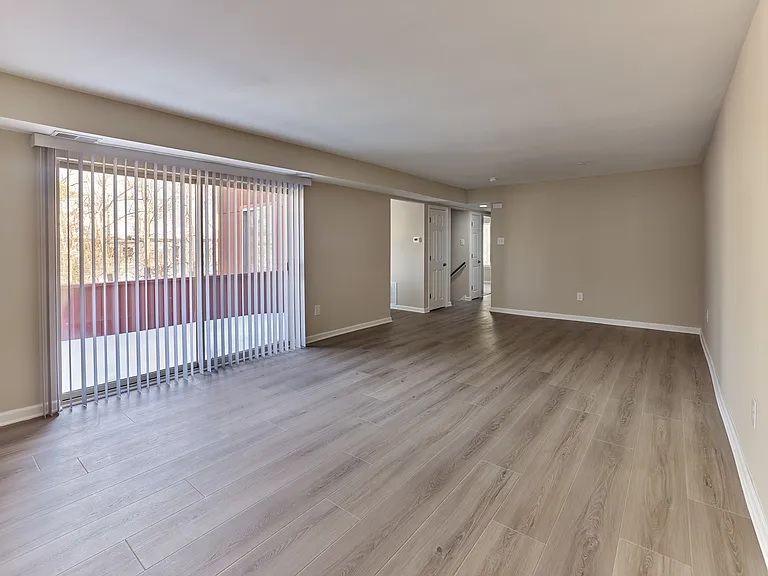 Expansive living area with private balcony in this 2 bedroom, 2 bathroom, 1,063 sq. ft. apartment at North Crossing in Willow Grove, PA.