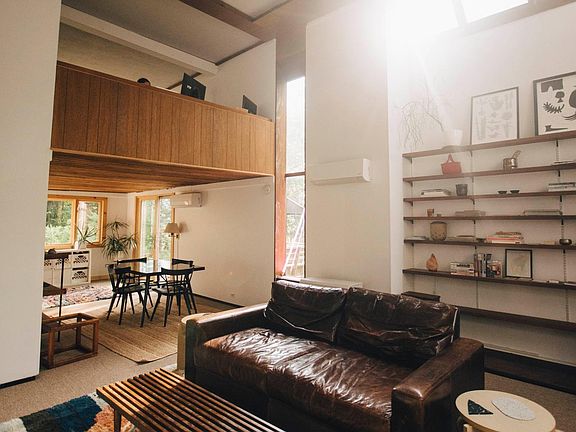 Living room, view of loft above.