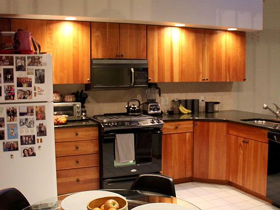 Large eat-in kitchen with cherry cabinets and granite countertops