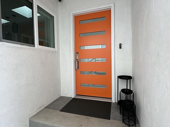 Covered entry, ring cam doorbell and perimeter cameras on house