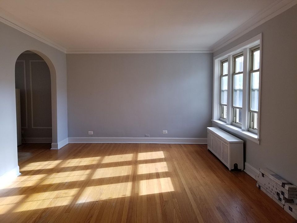 looking from the front foyer into living room. Dining room to the left