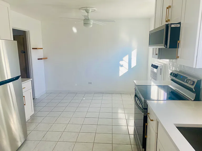 View of kitchen dining area fits large table.