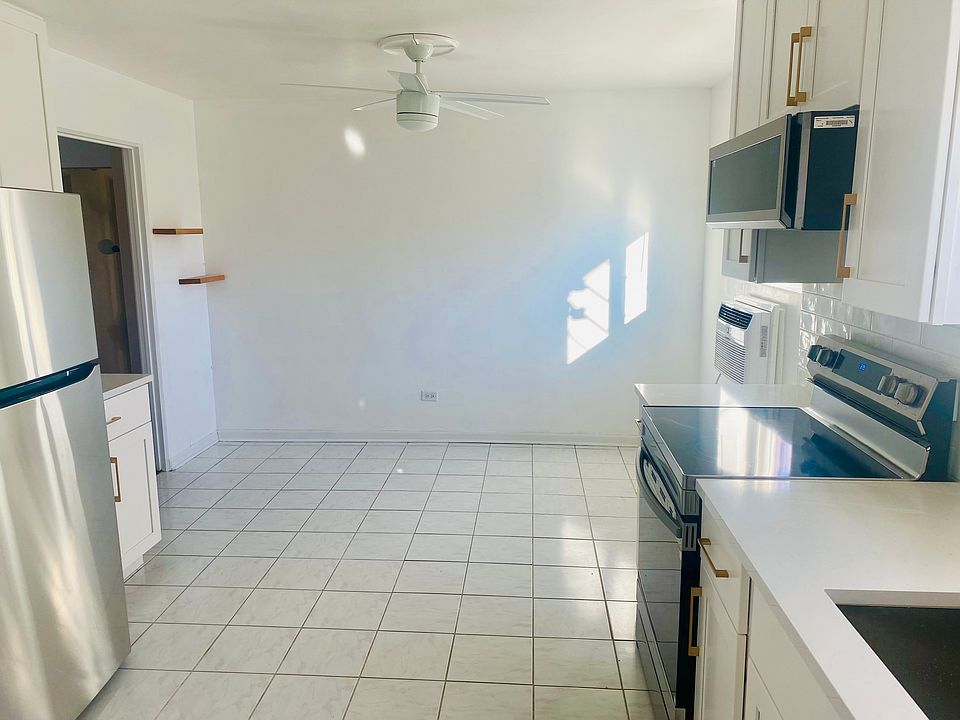 View of kitchen dining area fits large table.
