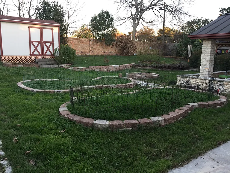 Fenced back yard with plenty of room for dogs to run around. Covered patio features a hammock to lounge in.