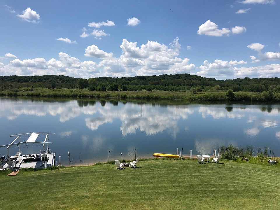 Your own private waterfront seating area, sandy beach entrance, very warm clean swimming and fishing water