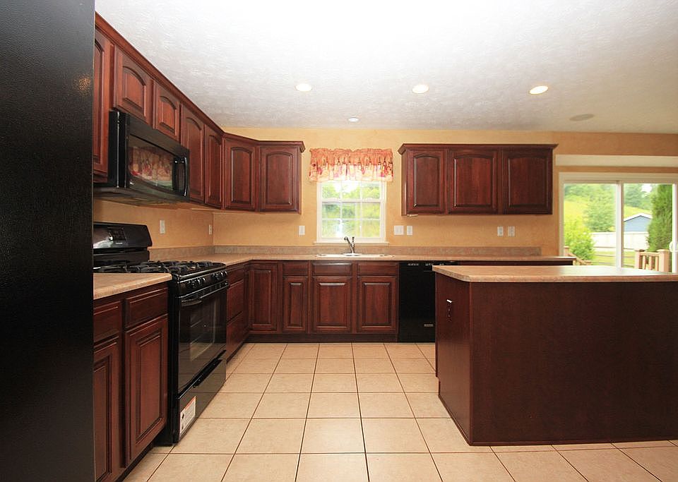 Lots of counter space and an island in the lovely kitchen
